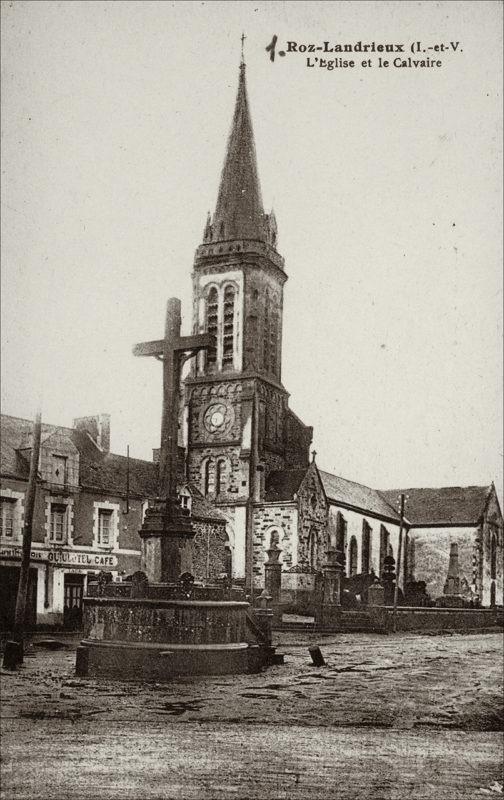 Le calvaire et l'église Saint-Pierre dans le bourg de Roz-Landrieux au début des années 1900.